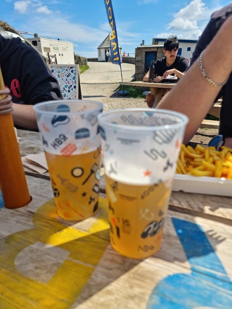 Custom branded festival cups in use at a stadium bar